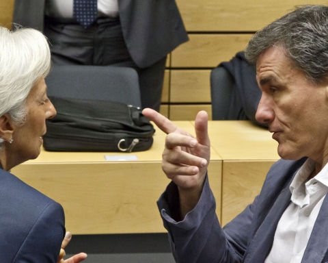 Greek Finance Minister Euclid Tsakalotos, right, speaks with Managing Director of the International Monetary Fund Christine Lagarde during a round table meeting of eurogroup finance ministers at the EU Lex building in Brussels on Sunday, July 12, 2015. Greece has another chance Sunday to convince skeptical European creditors that it can be trusted to enact wide-ranging economic reforms which would safeguard its future in the common euro currency. (AP Photo/Michel Euler)