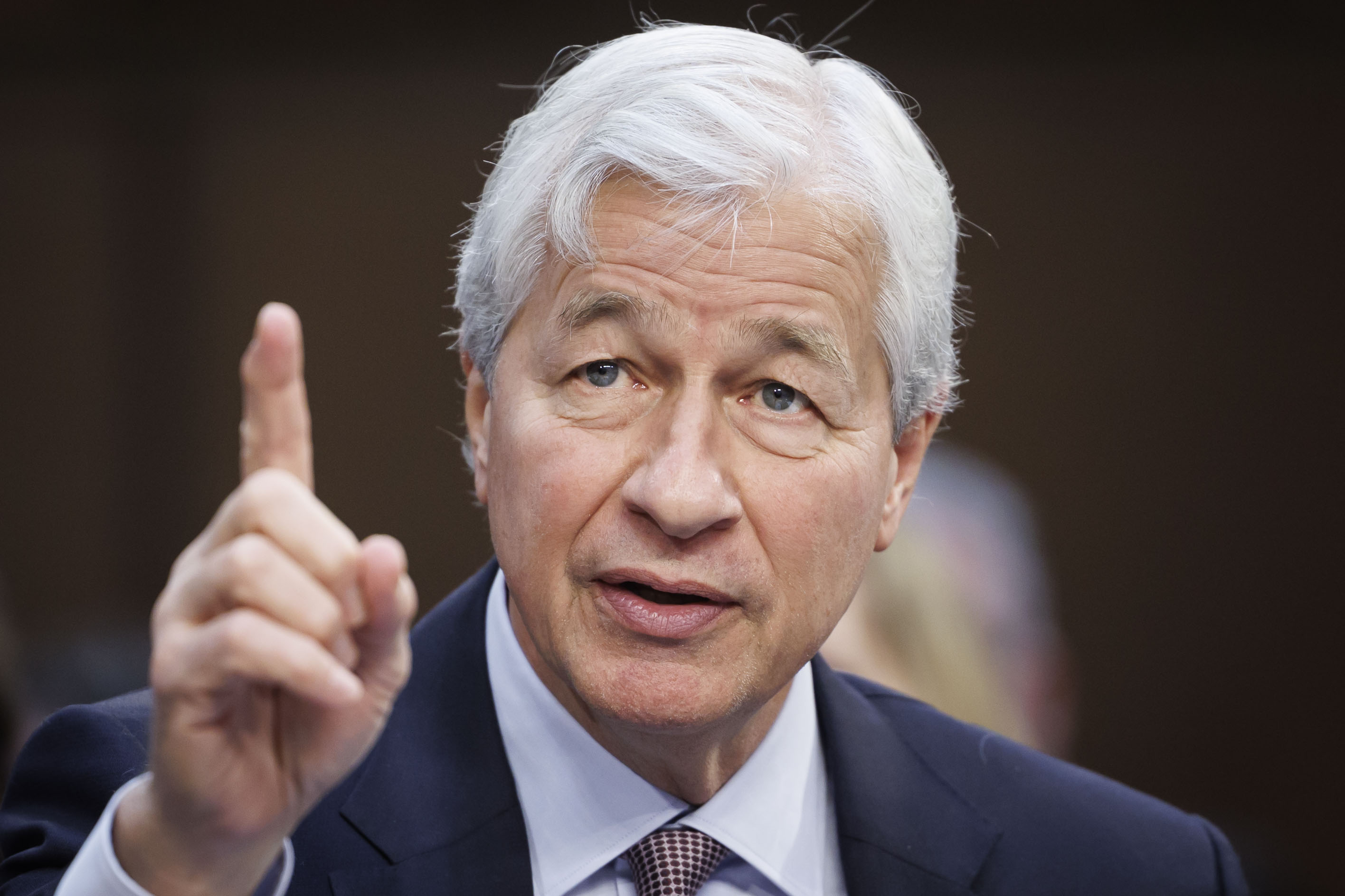 Jamie Dimon, chairman and chief executive officer of JPMorgan Chase & Co., speaks during a Senate Banking, Housing, and Urban Affairs Committee hearing in Washington, D.C., US, on Wednesday, Dec. 6, 2023. The heads of the biggest US banks will use the hearing to make their case for watering down rule proposals they argue will harm the economy. Photographer: Ting Shen/Bloomberg